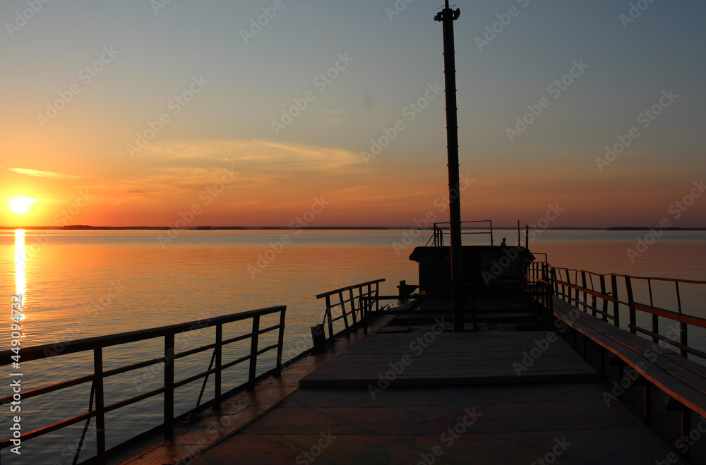 sunset in the sea on the ocean pier at the dawn of tourism