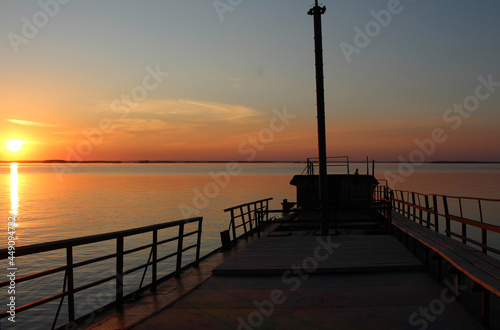 sunset in the sea on the ocean pier at the dawn of tourism
