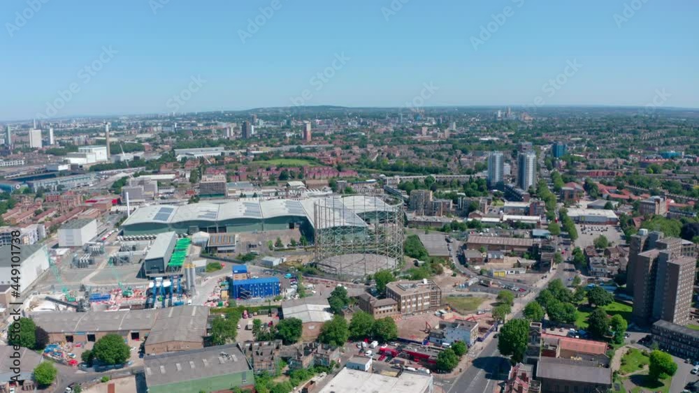 Dolly forward drone shot over industrial South East London on a sunny day Dolly forward drone shot over industrial South East London on a sunny day