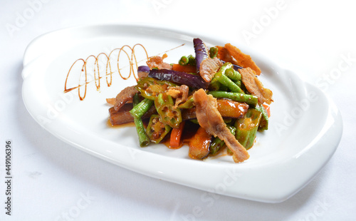 stir fried mixed vegetables with meat in spicy samba chilli sauce in white background asian halal menu