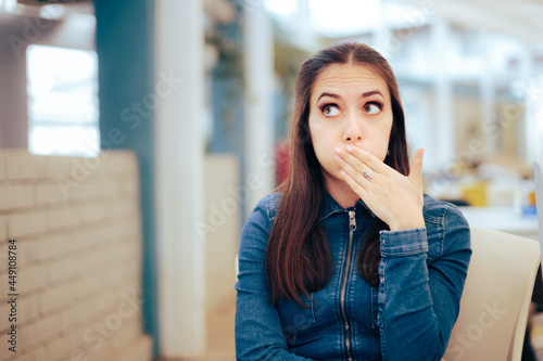 Woman Sitting in a Restaurant Feeling Sick and Nauseated photo
