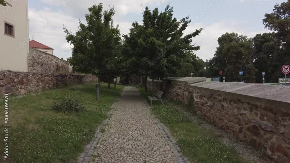 Walking along a path with ancient wall either side. Walking along a path with ancient wall either side.