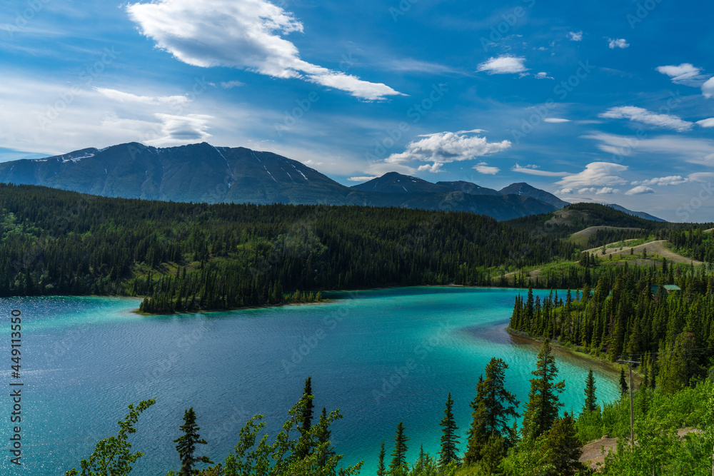 Emerald Lake, Yukon, Canada with mountains and forest on the background.