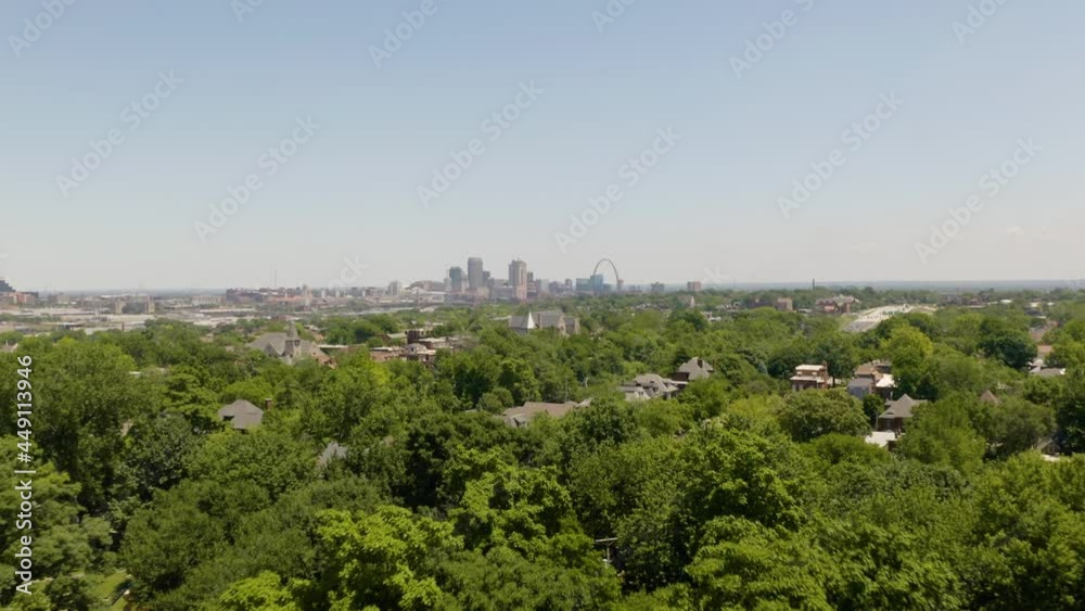 Low Aerial View St. Louis Suburbs, City Skyline in Background. Summer Afternoon Low Aerial View St. Louis Suburbs, City Skyline in Background. Summer Afternoon