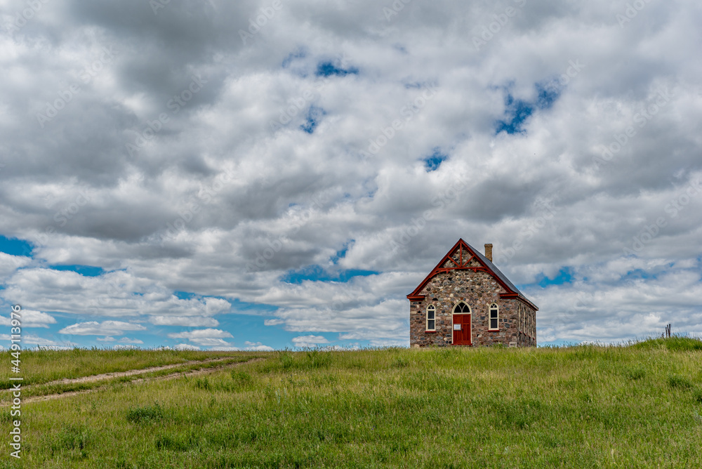 The historic stone Fairview United Church, built in 1903, and surrounding countryside, outside Regina, SK