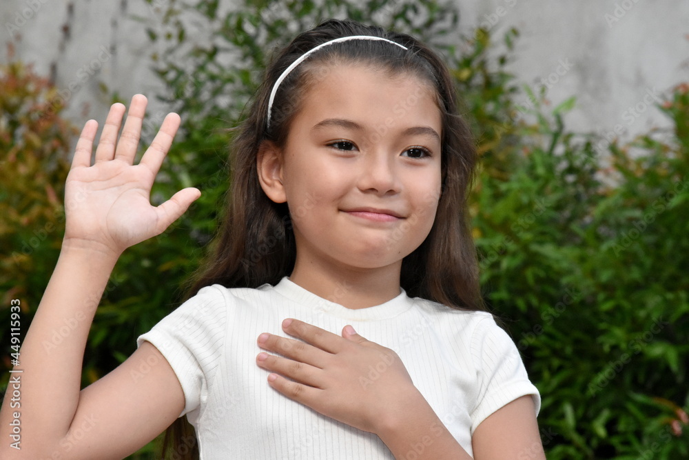 Youthful Philippina Child Pledging Allegiance Outdoors Youthful Philippina Child Pledging Allegiance Outdoors