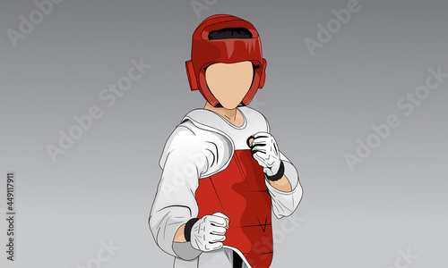 A young taekwondo fighter in a kimono, protective helmet, gloves. The background is abstract gray.