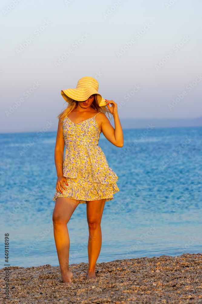 Girl on the Zlatni Rat beach near Bol town, Brač Island, the Adriatic Sea, Croatia