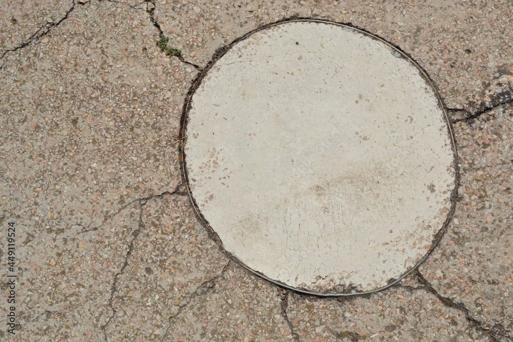 Abstract background of concrete sidewalk, floor, walkway, path, footpath, walkway or walkway. A fragment in the form of a large circle is highlighted on it. Abstract background of concrete sidewalk, floor, walkway, path, footpath, walkway or walkway. A fragment in the form of a large circle is highlighted on it.