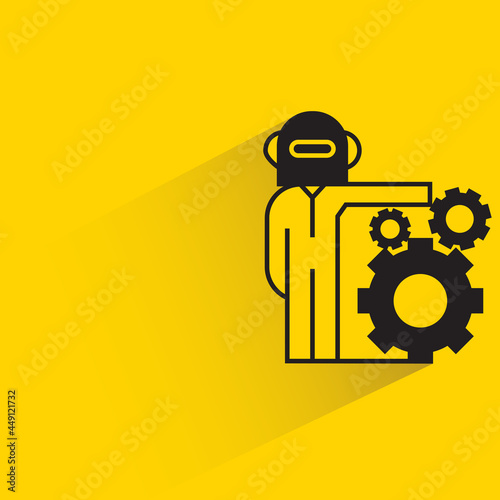robot and gears on yellow background