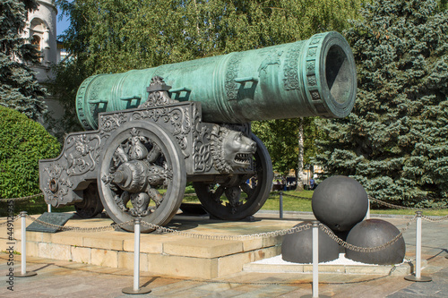 MOSCOW, RUSSIA-AUGUST, 4, 2021: a large bronze tsar cannon and cannonballs on Sobornaya Square in the Kremlin on a sunny summer day