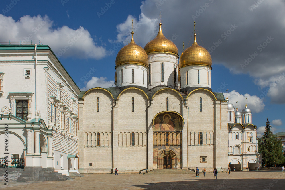 Cathedral of the Assumption of the Most Holy Theotokos with golden domes in the Kremlin on Cathedral Square on a sunny summer day in Moscow Russia