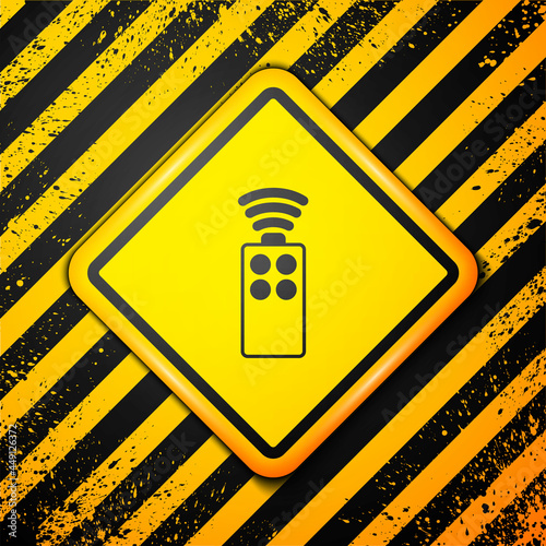 Black Remote control for the camera icon isolated on yellow background. An auxiliary device that allows you to work with a camera from a distance. Warning sign. Vector