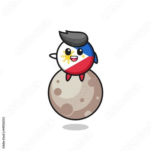 illustration of philippines flag badge cartoon sitting on the moon