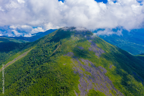 長野県茅野市と北佐久郡立科町にある八ヶ岳連峰の蓼科山をドローンで撮影した空撮写真 Aerial photo of Mount Tateshina in the Yatsugatake mountain range in Chino City and Tateshina Town, Kitasaku County, Nagano Prefecture, taken by drone. photo