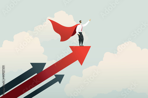 Superhero businessman pointing finger on rising arrow graph.