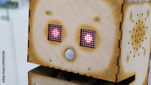 Exhibition of modern robots. The head of a wooden robot photo