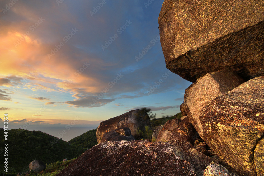 a close up of a large rock at sunrise