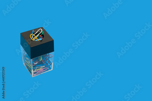 colored paper clips in a box. office accessories photo