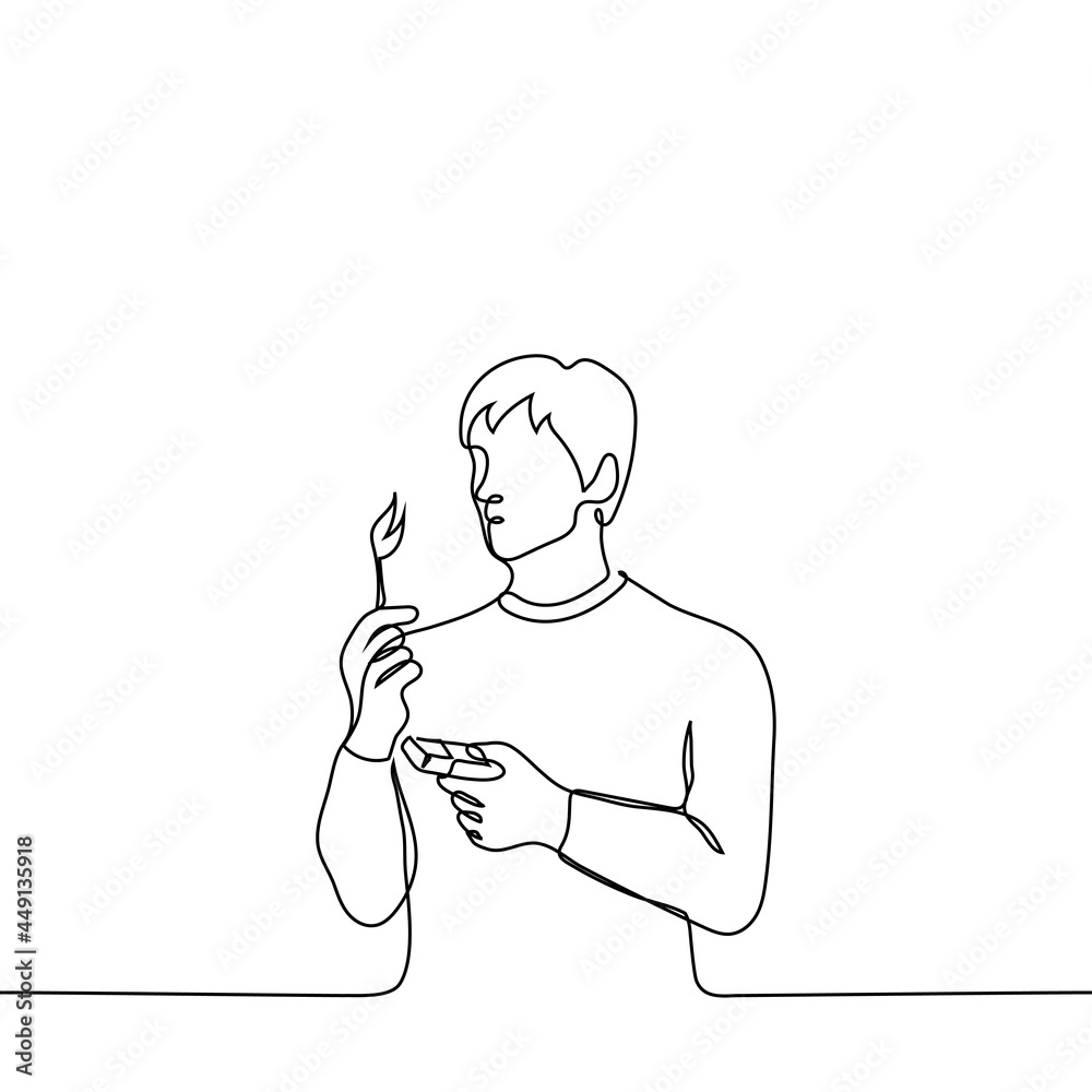 man stands looking at a burning match in his hand, with the other hand