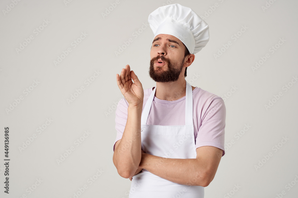 cheerful male chef in uniform gestures with his hands gourmet restaurant cheerful male chef in uniform gestures with his hands gourmet restaurant