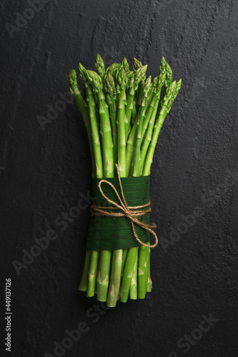 Asparagus from the garden on black stone background