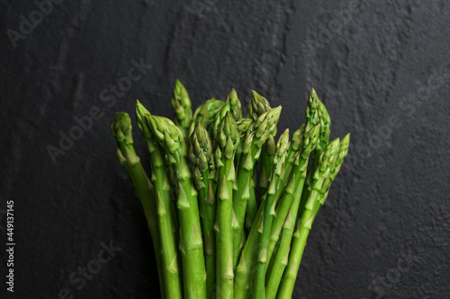 Asparagus from the garden on black stone background photo