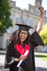 A female student feeling awesome about college graduation