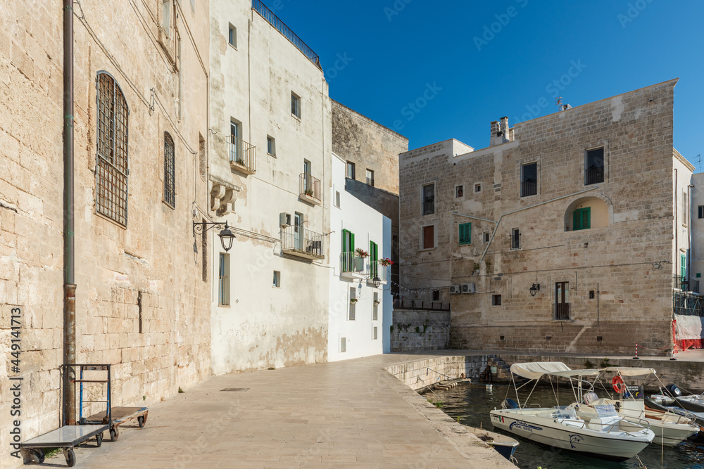 Strolling along the streets of Monopoli. Boats and places of magic