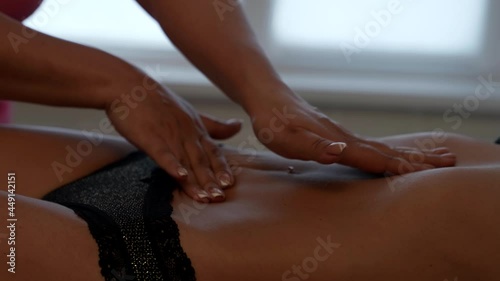 Wallpaper Mural the massage master performs movements on the muscles of the press the patient in the salon Torontodigital.ca