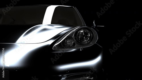 the black car gradually emerges from the darkness due to the illumination and disappears again in the darkness. close-up on headlights