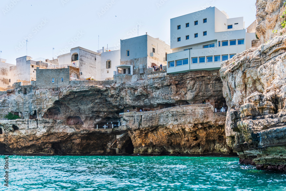 Polignano a Mare seen from the sea. Cliffs and caves