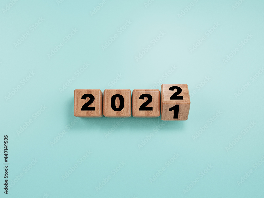 Wooden block flipping from 2021 to 2022 on blue background for preparation merry Christmas and happy new year , 3d render. Wooden block flipping from 2021 to 2022 on blue background for preparation merry Christmas and happy new year , 3d render.