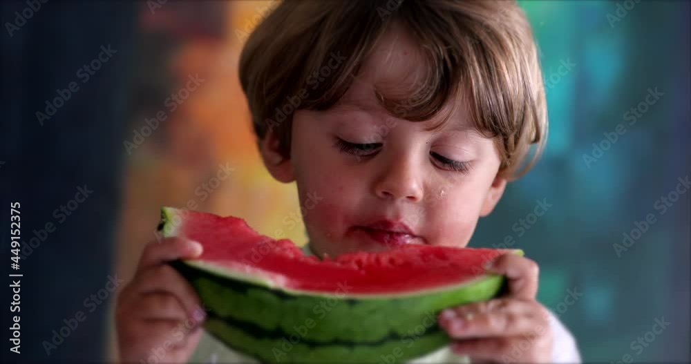 Child eating watermelon, toddler boy eating fruit