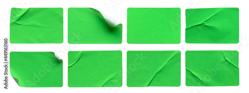 A set of green rectangular paper sticker label isolated on white background.