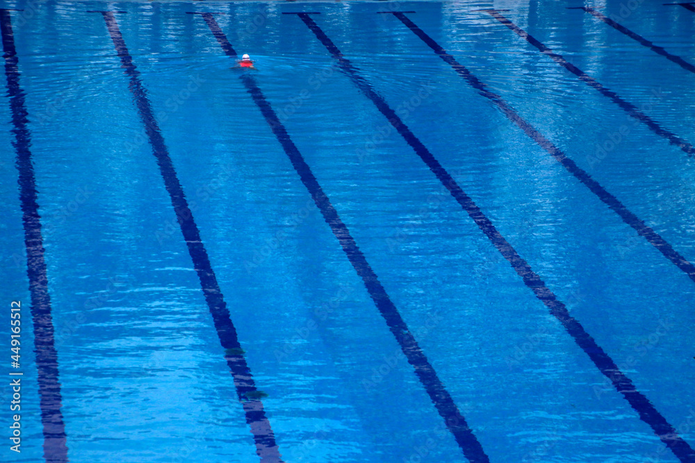 Person swimming alone in a pool