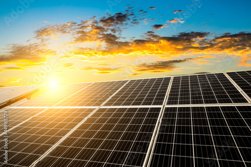 Solar power panels and beautiful natural landscape at sunset in summer in China