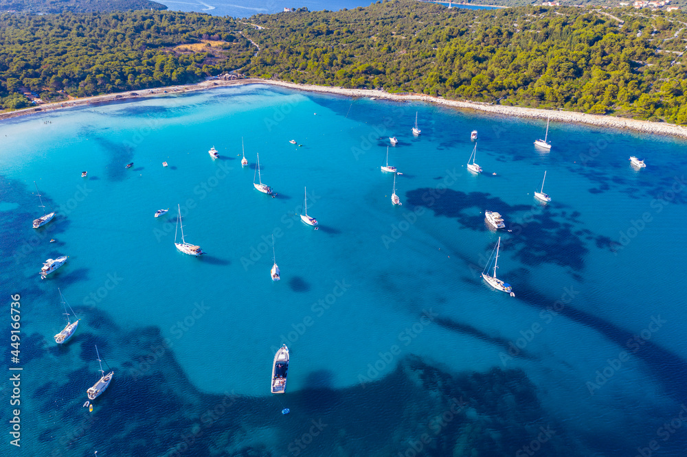 Aerial view of sailing boats in a beautiful azure turquoise lagoon on Sakarun beach bay on Dugi Otok island, Croatia, beautiful seascape
