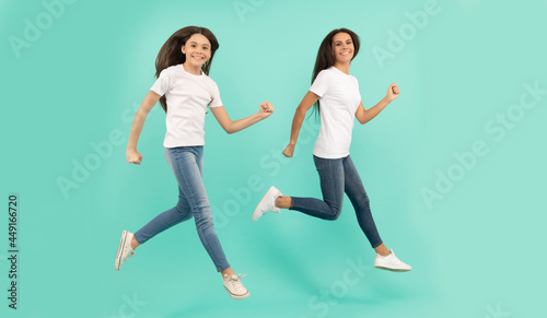 mother and daughter jump high. hurry up. happy childhood and motherhood. concept of friendship
