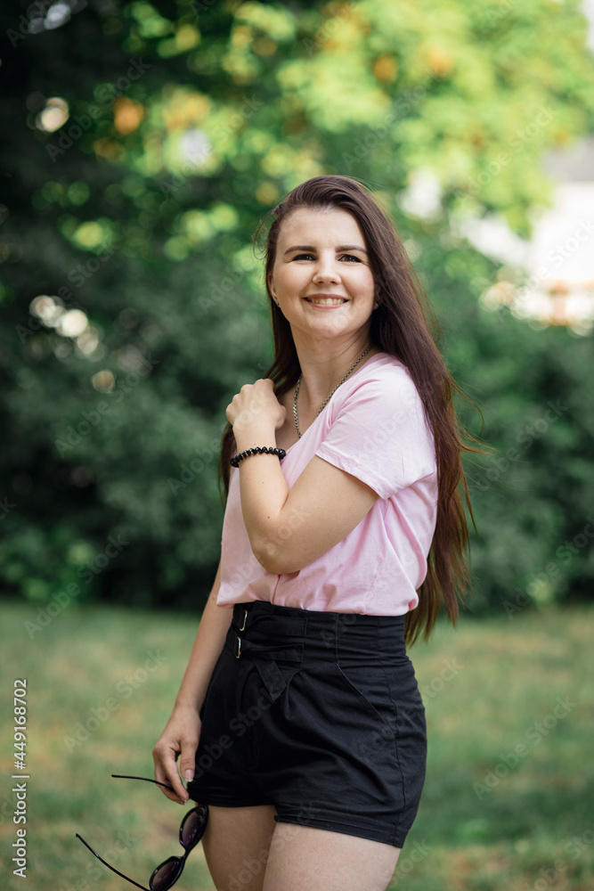 beautiful girl walks in the park. summer walks. portrait beautiful girl walks in the park. summer walks. portrait