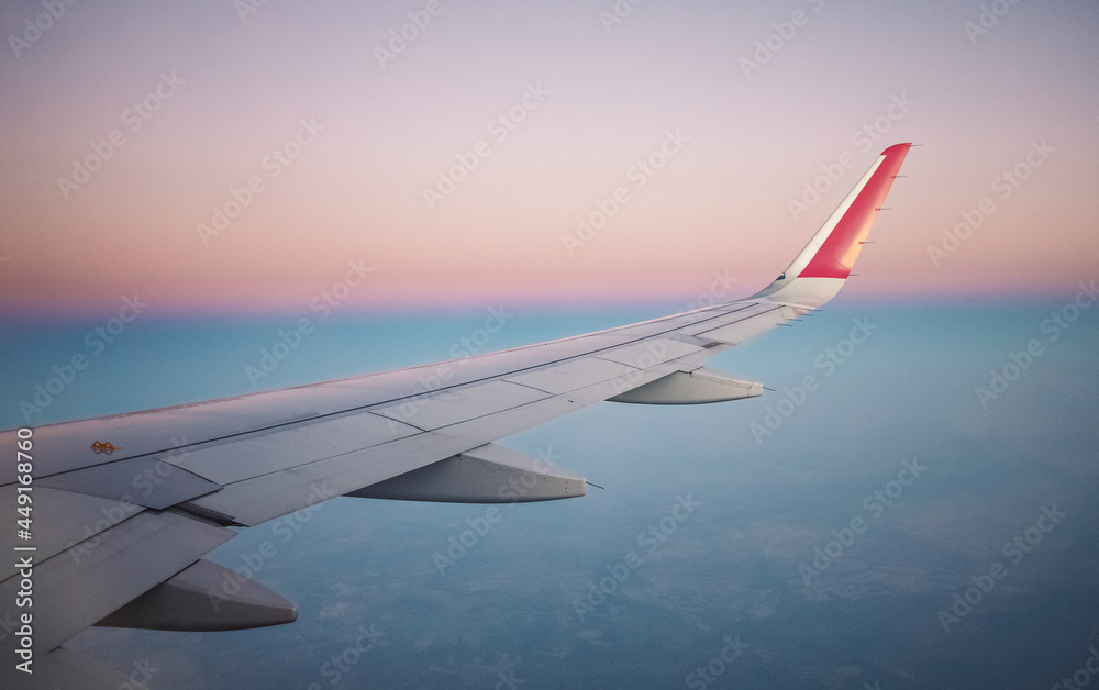 wing of an airplane in the sky during sunset. travel concept. flight by plane. wing of an airplane in the sky during sunset. travel concept. flight by plane.