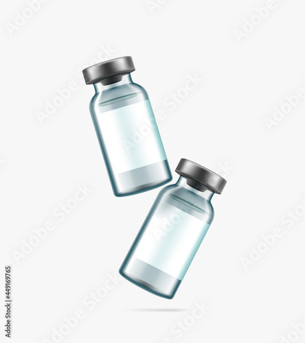 Glass vaccine bottles with blank stickers isolated on white background