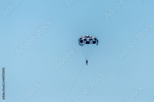 Paragliding in the blue sky