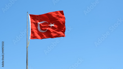 Turkish flag on cloudy sky background