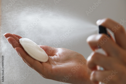 Wallpaper Mural Woman hands closeup applying liquid on cotton pad Torontodigital.ca