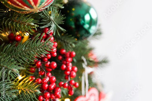 Christmas background - baubles and branch of spruce tree