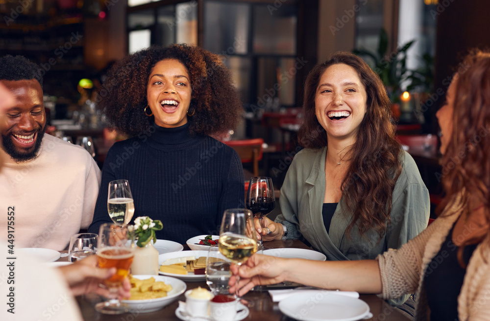 Friends laughing in restaurant