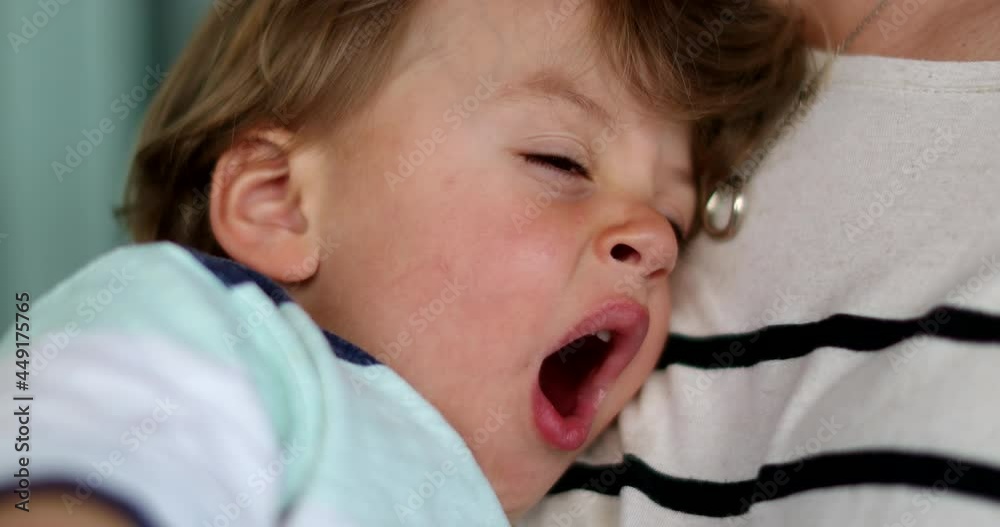 Tired baby yawning. toddler yawns about to nap Tired baby yawning. toddler yawns about to nap