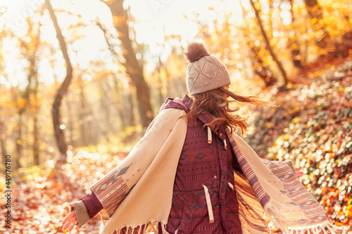 Woman spending sunny autumn day in nature