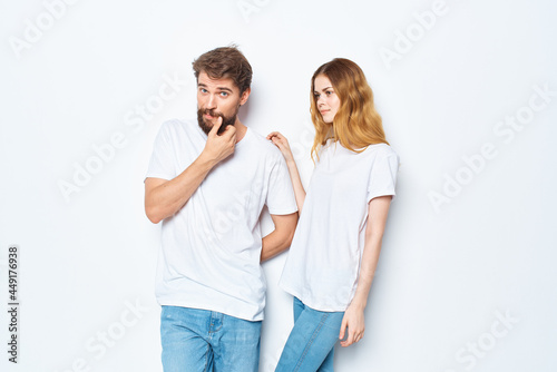fashionable young couple in white t-shirts and jeans mockup design